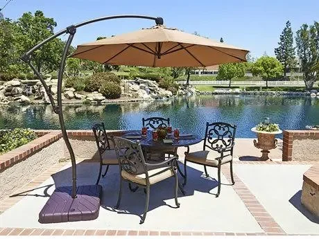 California Umbrella 9 ft. Bronze Aluminum Cantilever Patio Umbrella with Crank Open 360 Rotation in Aruba Sunbrella