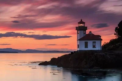 Framed Canvas Art - Orange Sunset at Lime Kiln Lighthouse by Shawn & Corinne Severn ( scenic & landscapes > Nautical