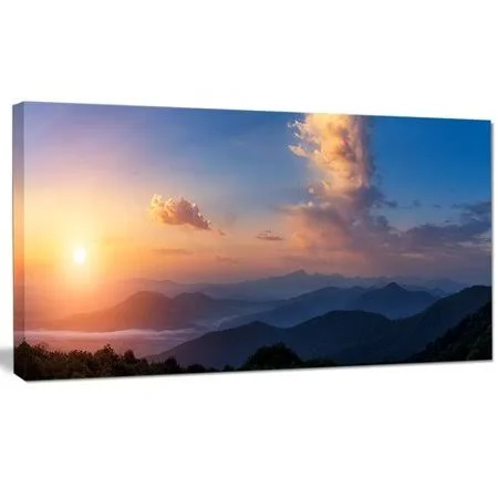 Design Art 'Dark Cloudy Sky Above Mountains' Photographic Print on Wrapped Canvas, Size: 20 inch H x 40 inch W x 1 inch D, Blue
